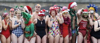 Swimmers participate in a Christmas Day race at the Serpentine in Hyde Park