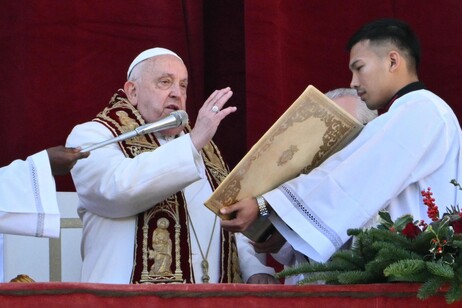 Pope Francis delivers the Urbi et Orbi message and blessing to the city and the world from the main