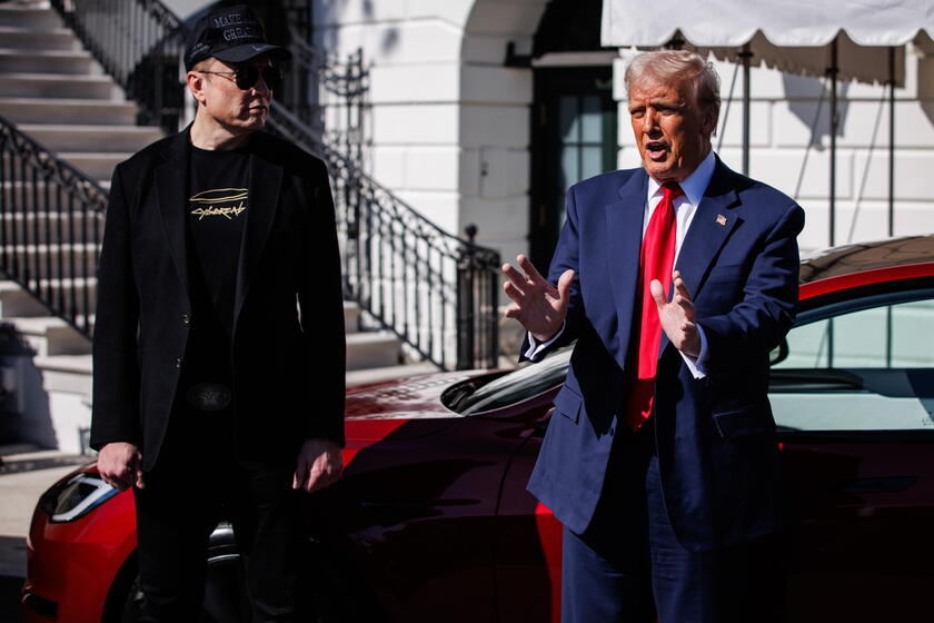 US President Trump views Tesla vehilces in front of the White House