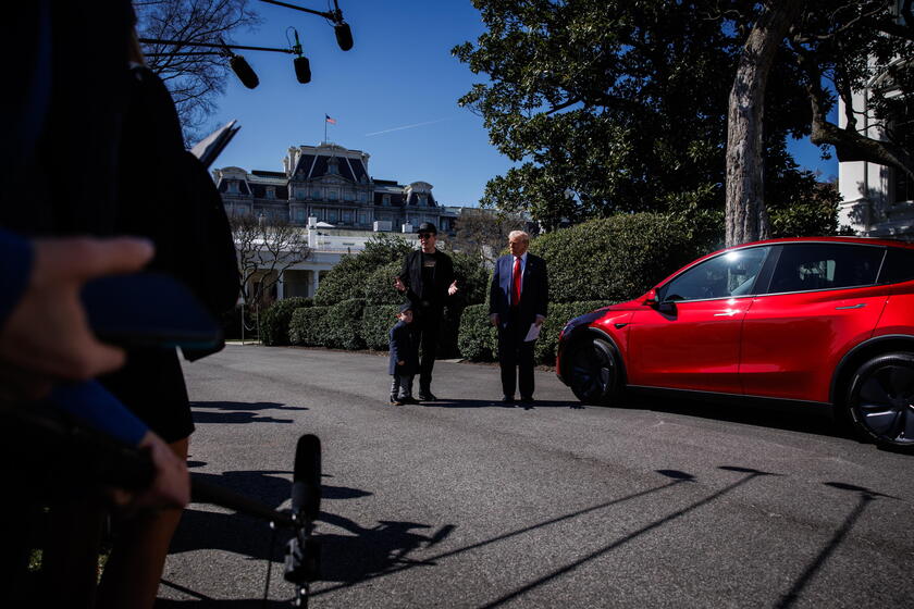 US President Trump views Tesla vehilces in front of the White House