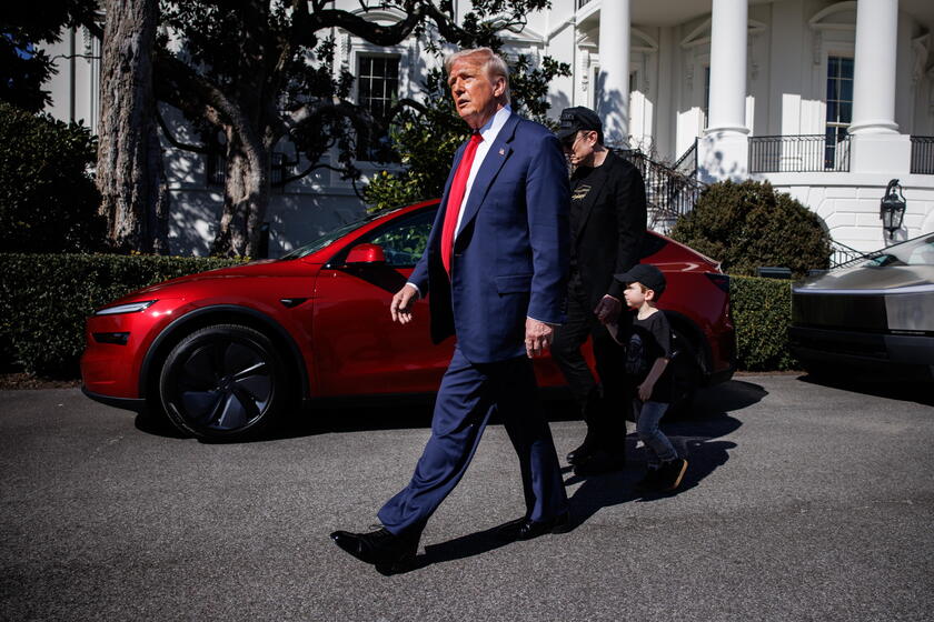 US President Trump views Tesla vehilces in front of the White House